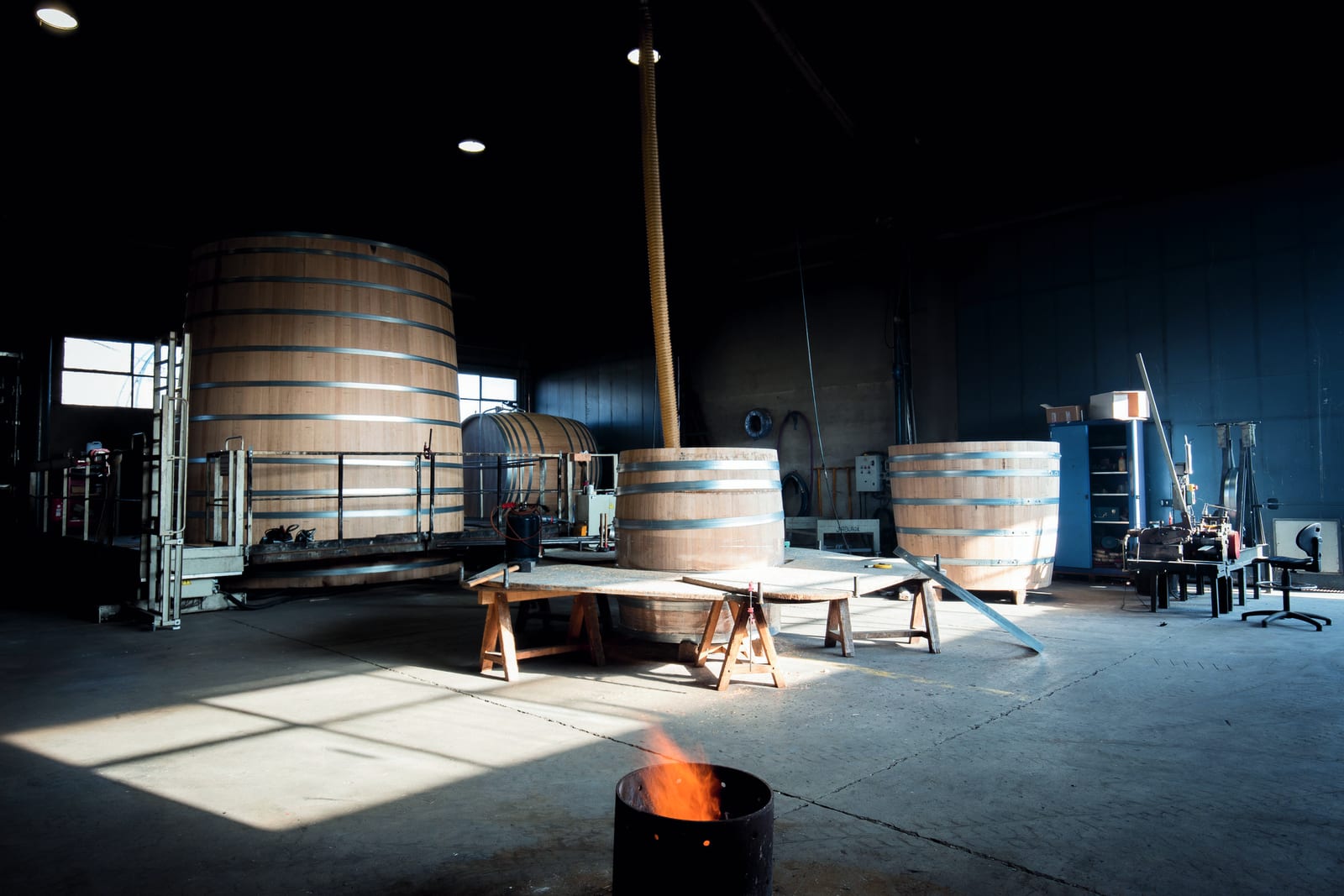 Large oak vats being assembled in a workshop